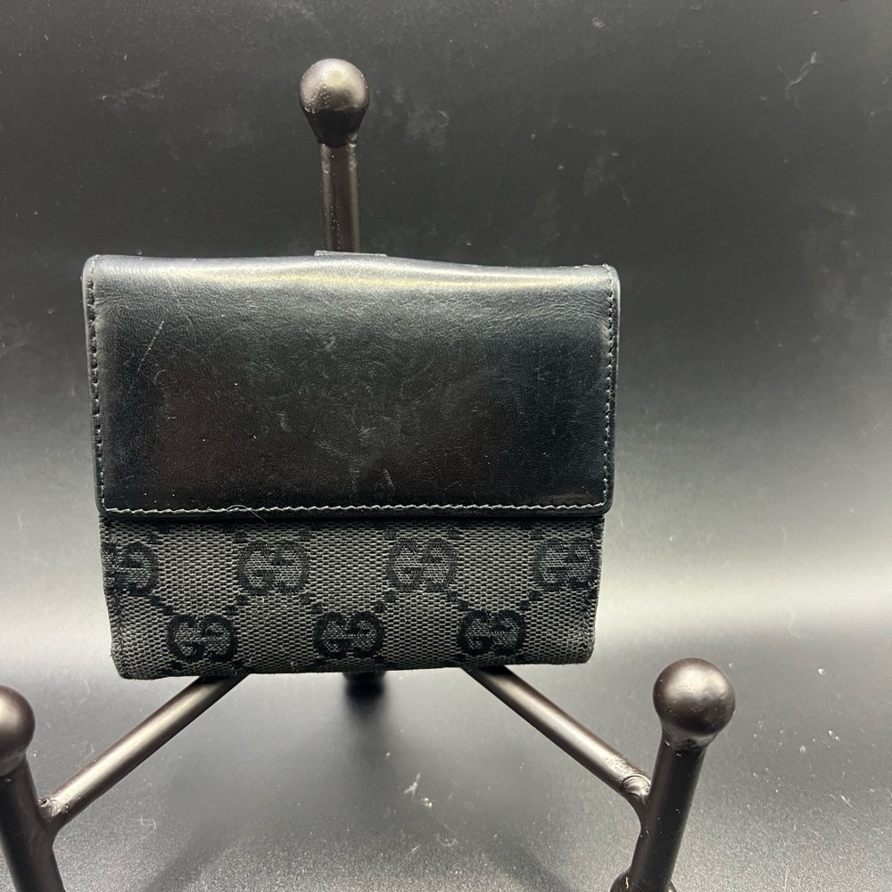 Gucci Black GG Canvas
Piston Lock Compact Wallet. - Picture 2 of 8